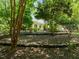 Landscaped front yard with rock walls and mature trees giving the property a secluded feel at 300 Oak Ridge Dr, Hillsborough, NC 27278