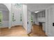 Spacious foyer with high ceilings flows into a home office with custom built-ins and ample natural light at 300 Oak Ridge Dr, Hillsborough, NC 27278
