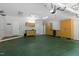 Spacious garage featuring cabinets and a sink; perfect for storage and workshop projects at 300 Oak Ridge Dr, Hillsborough, NC 27278