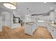 Spacious kitchen with white cabinetry, granite countertops, and hardwood floors at 300 Oak Ridge Dr, Hillsborough, NC 27278