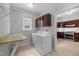 Bright laundry room featuring washer, dryer, granite countertop and cabinets at 300 Oak Ridge Dr, Hillsborough, NC 27278