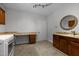 Spacious laundry room with sink, granite countertops, custom cabinets and modern appliances at 300 Oak Ridge Dr, Hillsborough, NC 27278