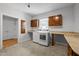 Functional laundry room with granite countertops and ample storage space at 300 Oak Ridge Dr, Hillsborough, NC 27278