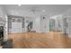 Large living room featuring a fireplace, a built-in cabinet, hardwood flooring, and plentiful natural light at 300 Oak Ridge Dr, Hillsborough, NC 27278