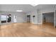 Spacious living room featuring hardwood floors, recessed lighting, multiple entryways, and built-in cabinets at 300 Oak Ridge Dr, Hillsborough, NC 27278