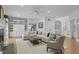 Elegant living room with hardwood floors, fireplace, built-in cabinets, and comfortable furnishings at 300 Oak Ridge Dr, Hillsborough, NC 27278