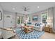 Cozy living room featuring hardwood floors, large windows, and a comfortable seating area at 300 Oak Ridge Dr, Hillsborough, NC 27278