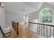 Bright living room with hardwood floors, large windows, and cathedral ceilings from second floor view at 300 Oak Ridge Dr, Hillsborough, NC 27278