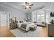 Elegant main bedroom with a tray ceiling, large bay window, and cozy seating area at 300 Oak Ridge Dr, Hillsborough, NC 27278