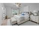 Main bedroom with a ceiling fan, luxury bedding, and bedside tables at 300 Oak Ridge Dr, Hillsborough, NC 27278