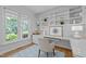 Cozy office space with built in shelves, a white desk, and blue patterned rug at 300 Oak Ridge Dr, Hillsborough, NC 27278