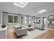 Bright and cozy sunroom with plentiful windows and natural light overlooking the backyard at 300 Oak Ridge Dr, Hillsborough, NC 27278
