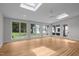 Bright and airy sunroom with skylights, hardwood floors, and large windows overlooking the backyard at 300 Oak Ridge Dr, Hillsborough, NC 27278