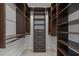 Large walk-in closet featuring built-in shelving and drawers for optimal organization at 300 Oak Ridge Dr, Hillsborough, NC 27278