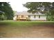 Wide shot of backyard with a wooden deck at 3145 Pier Pointe Dr, Creedmoor, NC 27522