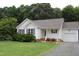 Charming home with manicured lawn, blue shutters, and a gravel driveway at 3145 Pier Pointe Dr, Creedmoor, NC 27522