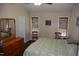 Bedroom with two windows, wood blinds, and wood-look flooring at 3145 Pier Pointe Dr, Creedmoor, NC 27522