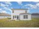 Exterior view of the backyard displaying a patio area and a neatly landscaped lawn at 316 Mimosa Ct, Sanford, NC 27332