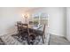 Cozy dining area featuring a wooden table, six chairs, and natural light from a window at 316 Mimosa Ct, Sanford, NC 27332
