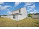 Side view of the house featuring a tidy backyard with ample space and sunlight at 316 Mimosa Ct, Sanford, NC 27332
