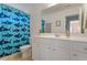 bathroom featuring a blue shower curtain with shark designs and a white vanity at 3217 Ranbir Dr, Durham, NC 27713