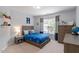 Comfortable bedroom with a well-coordinated theme, complemented by natural light from the window at 3217 Ranbir Dr, Durham, NC 27713