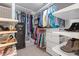 Organized walk-in closet featuring built-in shelving, drawers, and ample storage space for clothes and shoes at 3217 Ranbir Dr, Durham, NC 27713