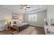 Bright bedroom with modern ceiling fan, neutral color palette, and stylish decor for a comfortable retreat at 3421 Lebrun Path, Fuquay Varina, NC 27526