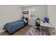 Cozy bedroom with a single bed, desk area, neutral walls, and a window providing natural light at 3421 Lebrun Path, Fuquay Varina, NC 27526