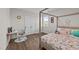 Cozy bedroom featuring a four-poster bed, a playful floral comforter, and a dedicated study desk at 3421 Lebrun Path, Fuquay Varina, NC 27526