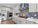 Well-equipped kitchen with modern appliances, sleek countertops, and a blue tiled backsplash for a contemporary feel at 3421 Lebrun Path, Fuquay Varina, NC 27526