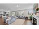 Bright and spacious living room with large sectional sofa, fireplace, and hardwood floors at 3421 Lebrun Path, Fuquay Varina, NC 27526