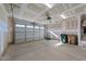 Spacious two-car garage featuring an automatic door opener, ample lighting, and concrete flooring at 35 Windflower Court Ct # Homesite 9, Clayton, NC 27520