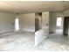Unfinished living room shows bare walls and concrete floors at 35 Windflower Court Ct # Homesite 9, Clayton, NC 27520