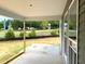 Covered patio area with natural light, perfect for outdoor relaxation and enjoying the surrounding views at 35 Windflower Court Ct # Homesite 9, Clayton, NC 27520