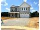 Charming two-story home with a covered front porch and a two-car garage at 35 Windflower Ct # Homesite 9, Clayton, NC 27520