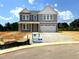 Charming two-story home with a covered front porch and two-car garage at 35 Windflower Ct # Homesite 9, Clayton, NC 27520