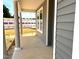 Covered porch with round columns and a view of the surrounding construction at 35 Windflower Ct # Homesite 9, Clayton, NC 27520