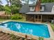 Large in-ground pool with a screened in porch area attached to the house at 3516 Swift Dr, Raleigh, NC 27606