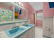 Bright bathroom with double sink vanity, retro-style tile, and shower-tub combo at 3516 Swift Dr, Raleigh, NC 27606