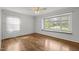 Inviting bedroom with hardwood floors, a large bay window with a window seat, and natural light at 3516 Swift Dr, Raleigh, NC 27606