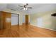 Large bedroom with neutral walls, a ceiling fan, closet, and hardwood floors at 3516 Swift Dr, Raleigh, NC 27606