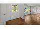 Charming entryway featuring a glass-paneled front door, hardwood floors, and access to the living room at 3516 Swift Dr, Raleigh, NC 27606