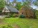 Beautiful brick home with a covered carport, landscaped yard, and vibrant hydrangea bushes at 3516 Swift Dr, Raleigh, NC 27606