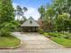 Charming brick home featuring an attached covered carport and beautifully landscaped front yard at 3516 Swift Dr, Raleigh, NC 27606