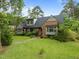 Charming two-story brick home with a landscaped yard and inviting curb appeal at 3516 Swift Dr, Raleigh, NC 27606