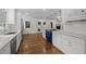 Bright, updated kitchen with white cabinets, marble counters, and a striking blue range oven at 3516 Swift Dr, Raleigh, NC 27606