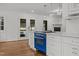 Beautiful kitchen with white cabinets, marble countertops, and a blue oven, perfect for culinary enthusiasts at 3516 Swift Dr, Raleigh, NC 27606