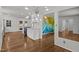 Open-concept kitchen flowing into a living area, featuring sleek countertops and bright, airy atmosphere at 3516 Swift Dr, Raleigh, NC 27606