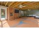 Back patio with brick fireplace and mounted TV, creating a relaxing outdoor living space at 3516 Swift Dr, Raleigh, NC 27606